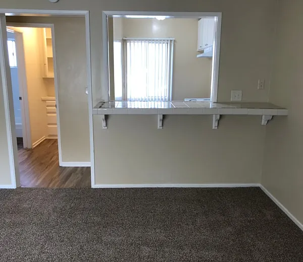 Older Model unit with Bartop to Kitchen from Living Room