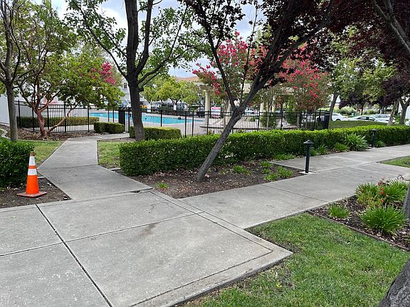 Front View with sparkling community pool