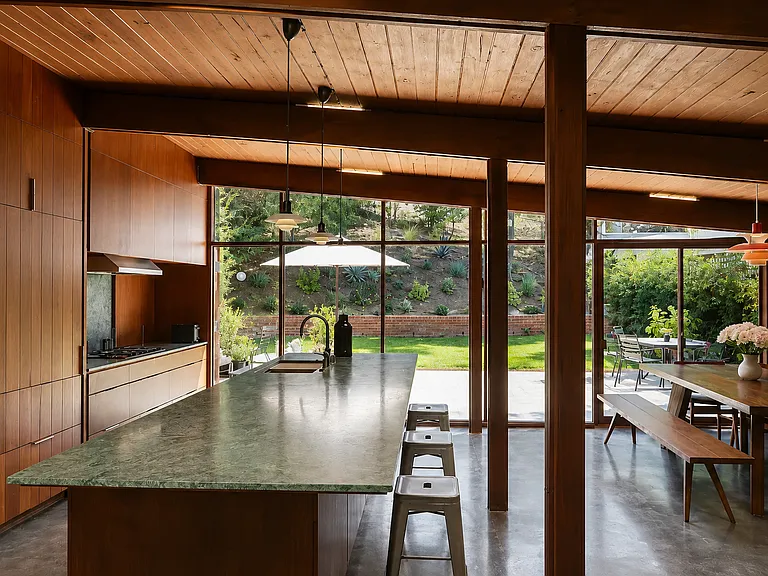 Kitchen with green marble island, opening to patio and dining room _ A. Quincy Jones, 1951