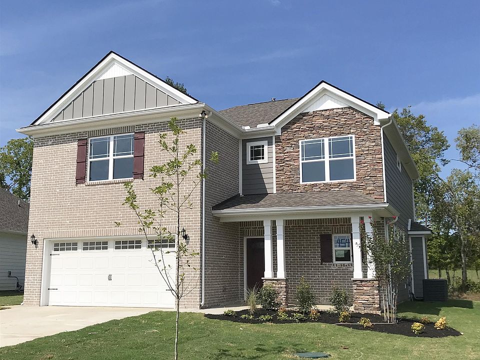 Our new grey brick and grey Hardie siding, stone and burgundy accents.