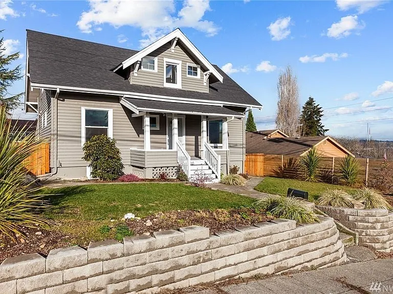 Classic Craftsman charm meets modern convenience, with abundant street parking plus a private rear alley providing access to covered parking, a large storage room, and a spacious fenced backyard.