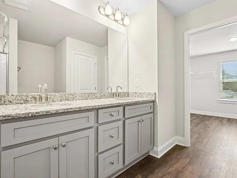 Elegant en suite with a double vanity off the primary bedroom.