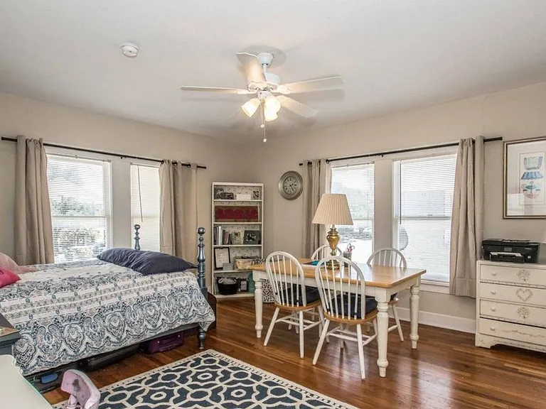 Large 210 sq ft master bedroom with enough room to fit a table and chair set