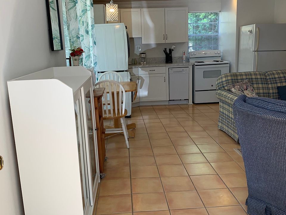 Entryway into open living/kitchen/dining area
