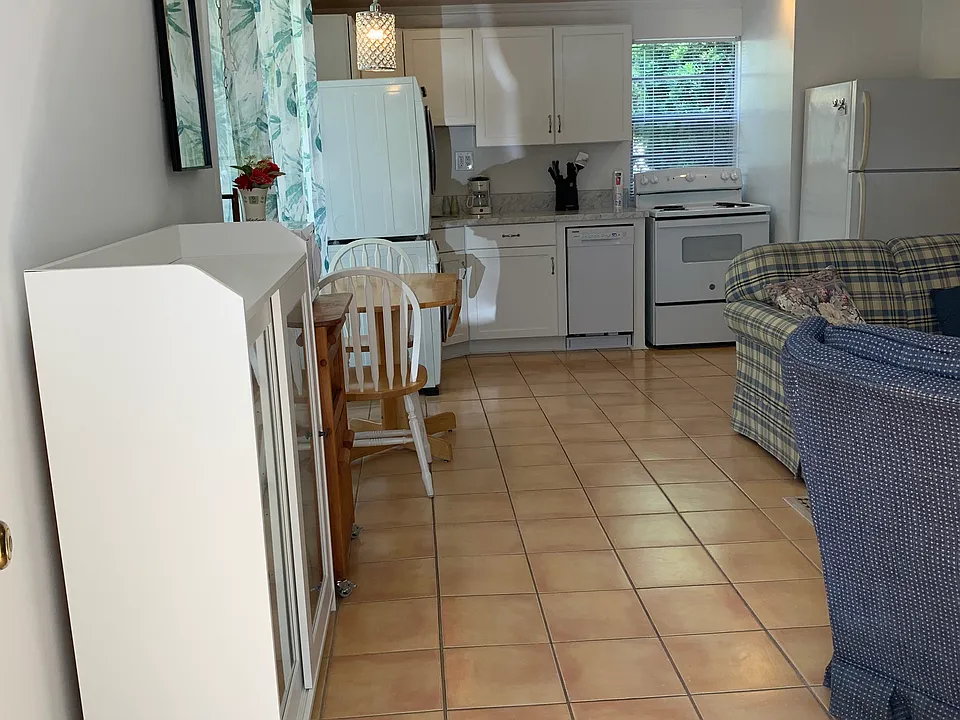 Entryway into open living/kitchen/dining area