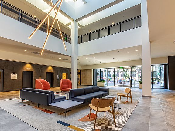 Lobby with push seating area and elevators.