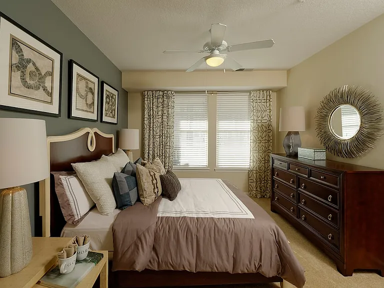 Bedroom with accent wall and carpet