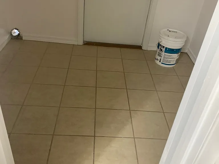 Hall bath leads to ample sized indoor laundry