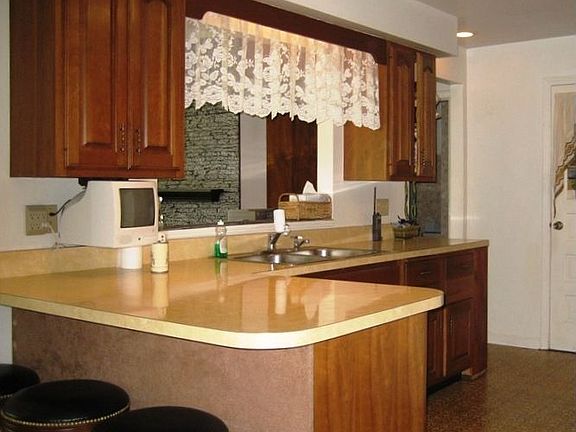 Kitchen with pass thru to the Living Room and open to Dining area
