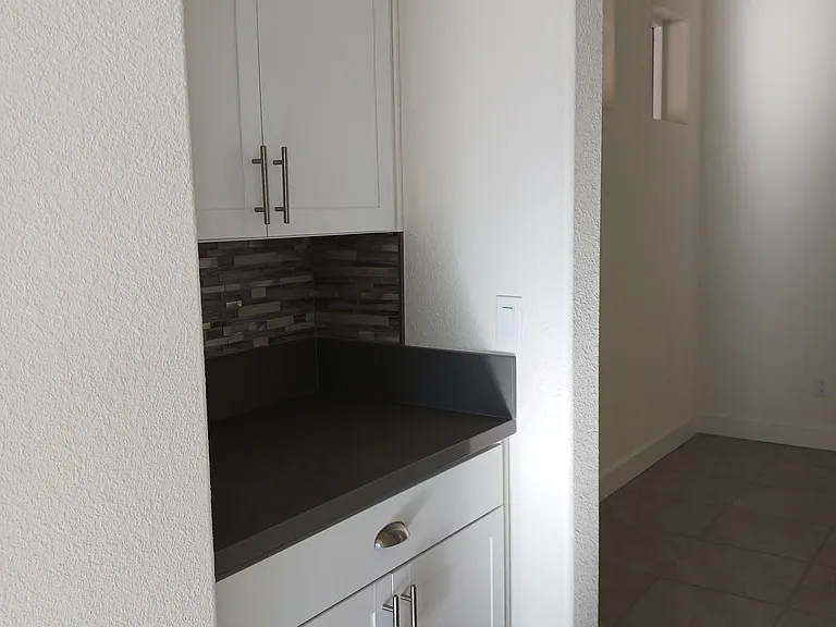butler's pantry or serving pantry, or a coffee bar/beverage station