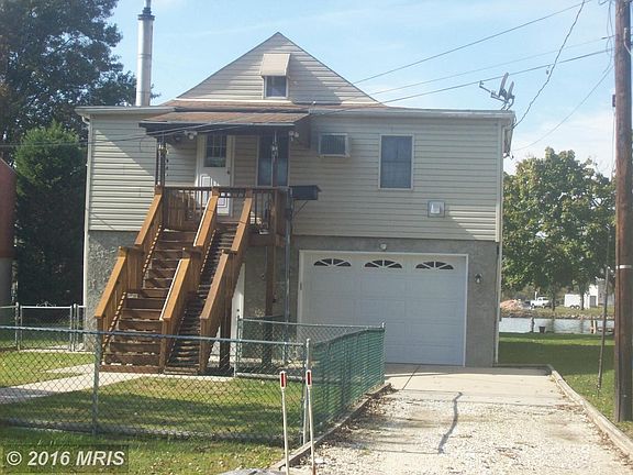 Street side View of home, part. fenced