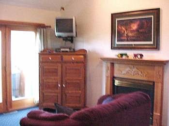 Family room offers fireplace & access to back yard