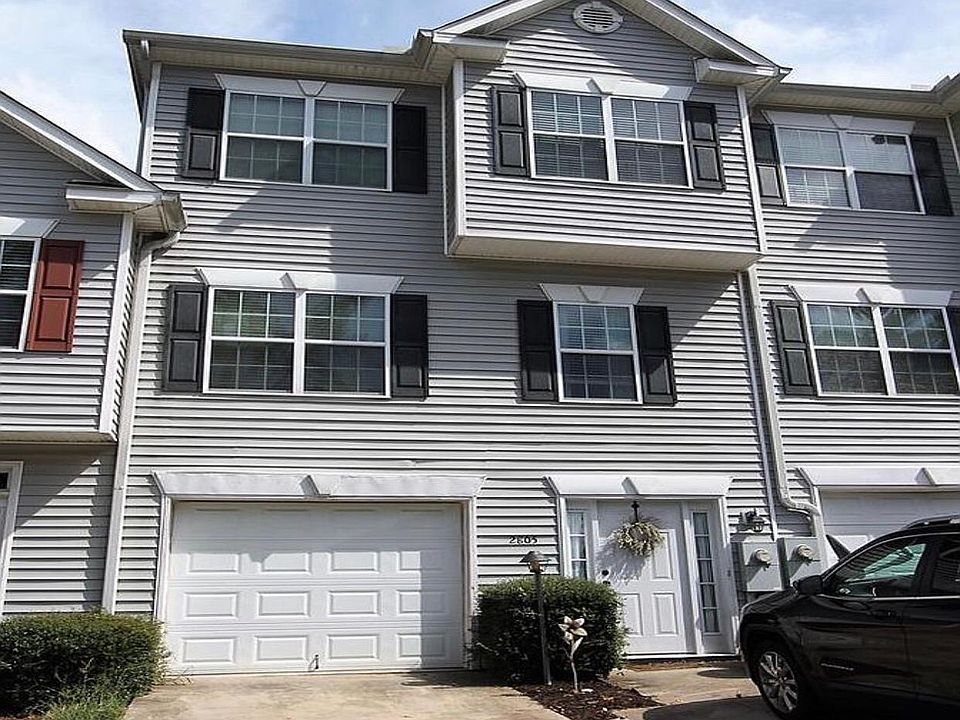 Exterior with 1 car garage and 2 parking spaces