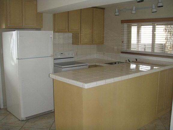 FULL SIZE KITCHEN WITH REFRIDGERATOR AND STOVE