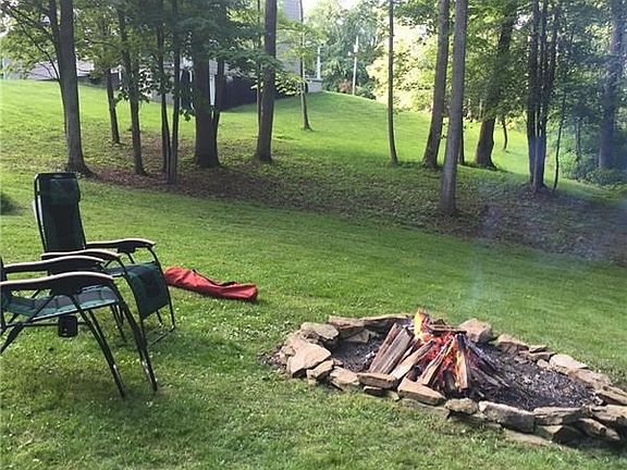 OVER AN ACRE WOODED AND PRIVATE LOT WITH FIRE PIT.