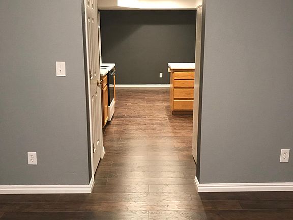 View into kitchen/dining room from living room, all new hard
