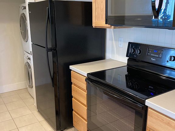 A pocket door separates the laundry and kitchen