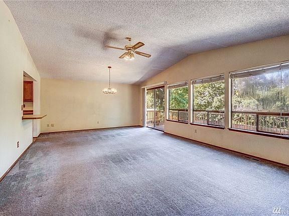 This spacious home offers vaulted ceilings and an open floor plan. 