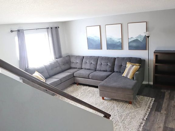 Living room of similar unit prior to updates.