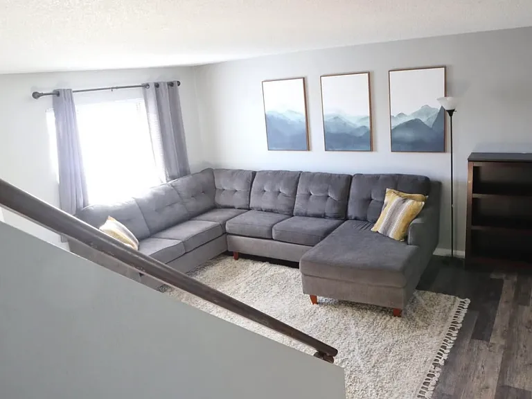 Living room of similar unit prior to updates.