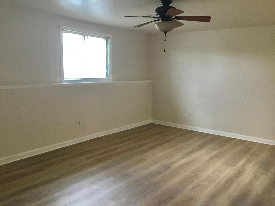 Living room - wood lam flooring - ceiling fan and/or central air