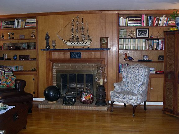 Living Room with built in bookcases surrounding fireplace