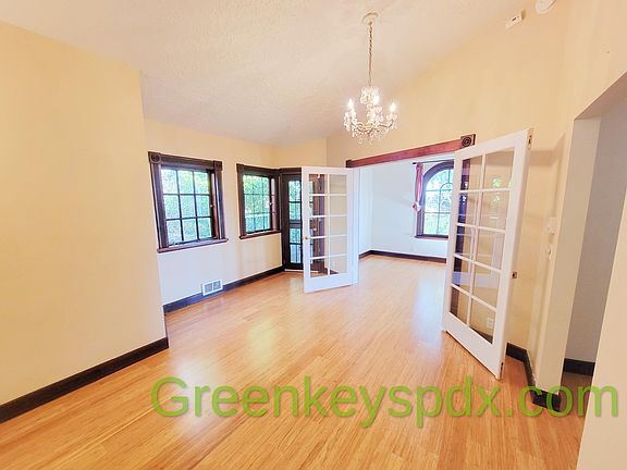 Beautiful hardwood floors, French doors, chandeliers