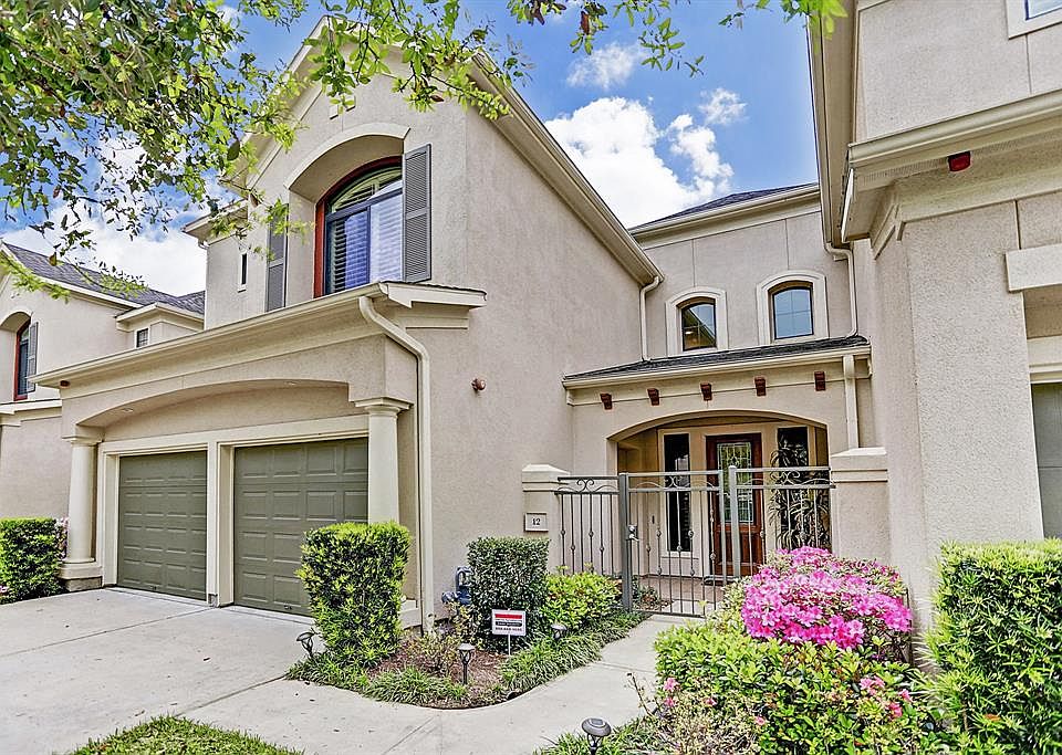 Tuscan style townhome in Sweetwater has a private, gate porch