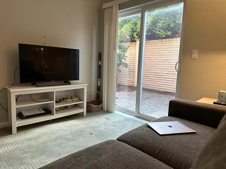 First Floor Bedroom - Can be used as a media room, a man-cave, an office, or ... as a bedroom. Opens into backyard. With attached full-bathroom.