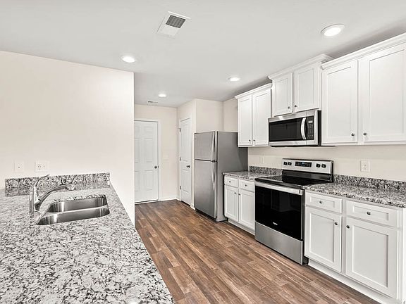 Fully loaded kitchen with stainless appliances