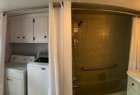 Upstairs bathroom, tub, washer and dryer will stay in home.