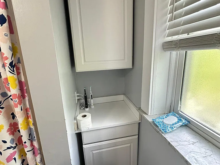 storage cabinet in bathroom