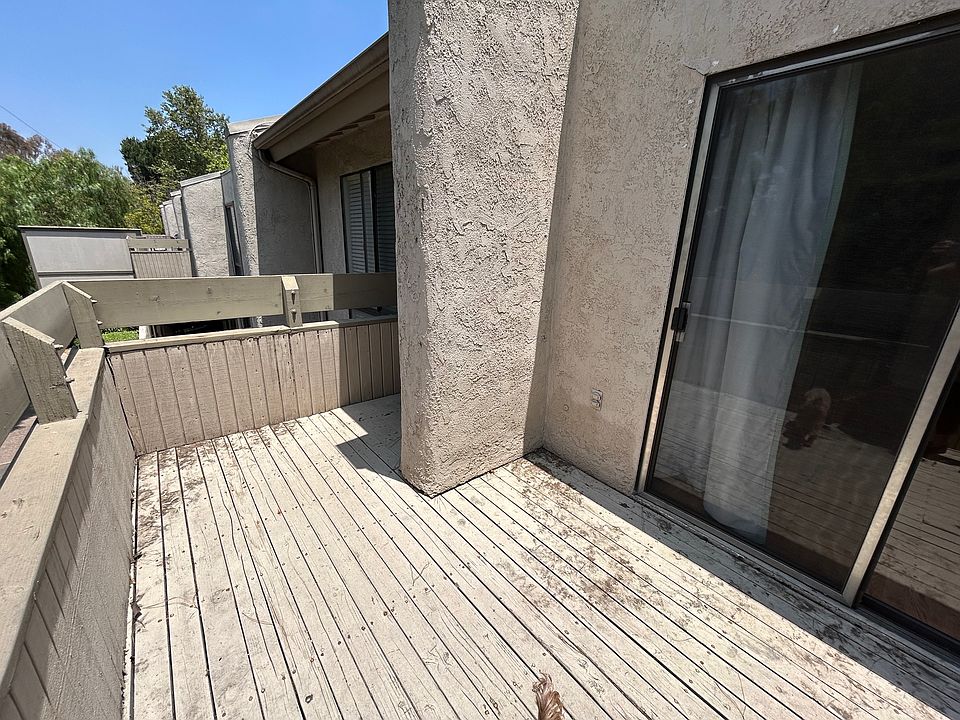 Spacious balcony with sliding glass doors attached to Bedroom 1.