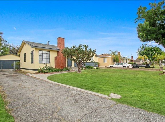 Long driveway leading to 2 car detached garage.