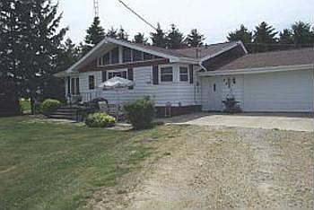 This home features a 2 car attached garage and a concrete patio in the front of home.