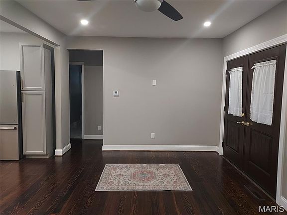 French doors bring you into large Living room open to Kitchen/Dining