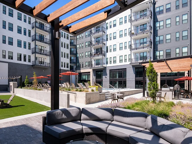 Unwind under the pergola in our stylish outdoor lounge.