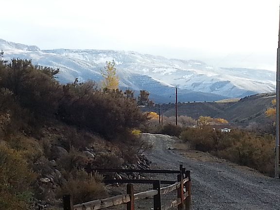 Looking down driveway to Grand Mesa