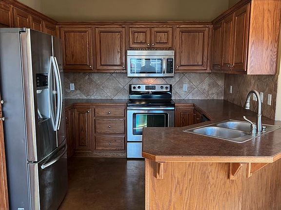 Kitchen; stove, microwave, and refrigerator included