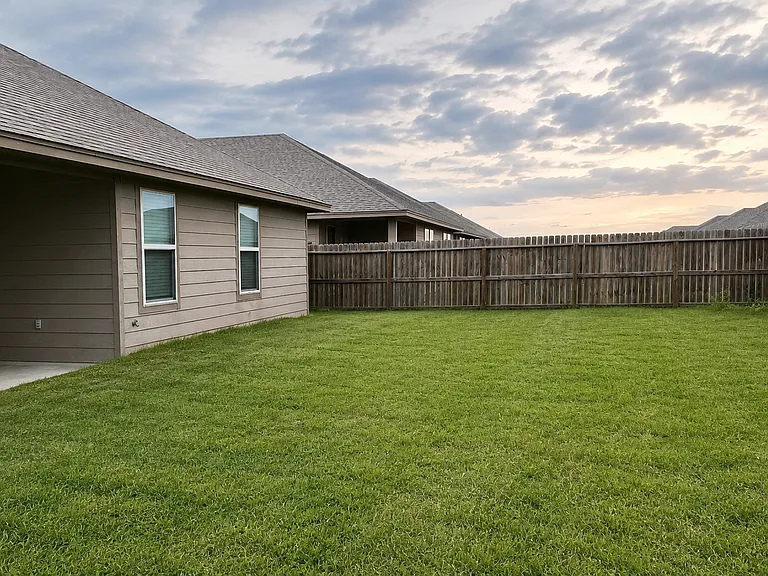 Private fenced backyard