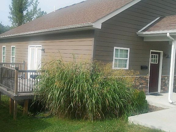 East side with deck and privacy fencing Note the French doors leading to the outside deck.