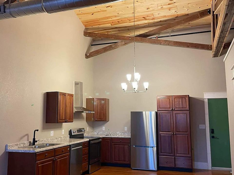 Open kitchen. Complete with under cabinet lighting, dishwasher, garbage disposal, vaulted ceilings, and beautiful hardwood floors.