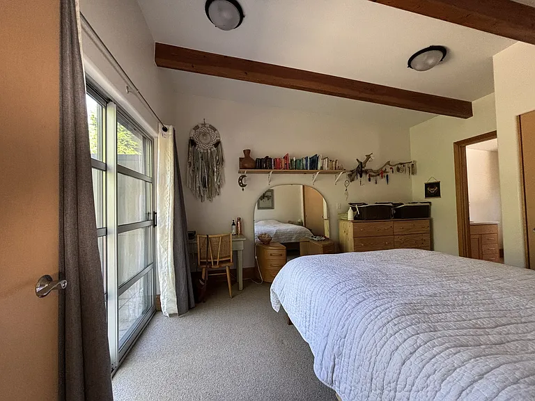 Upstairs primary bedroom has an attached bathroom and plenty of closet space.