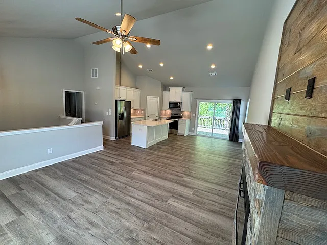 Open Concept Rooms including Living Area Kitchen, and Dining Area