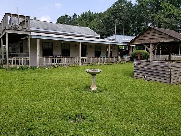 Front of home with wellhouse