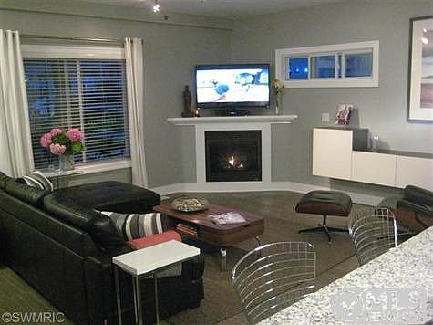Living Room with gas log fireplace, Italian porcelan tile and open living concept