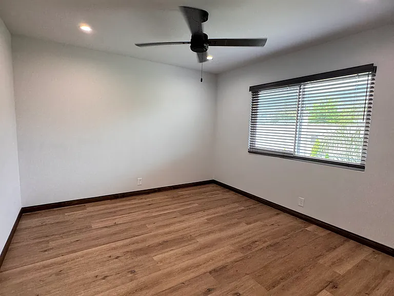 Ceiling fan and dual pain windows with custom window coverings