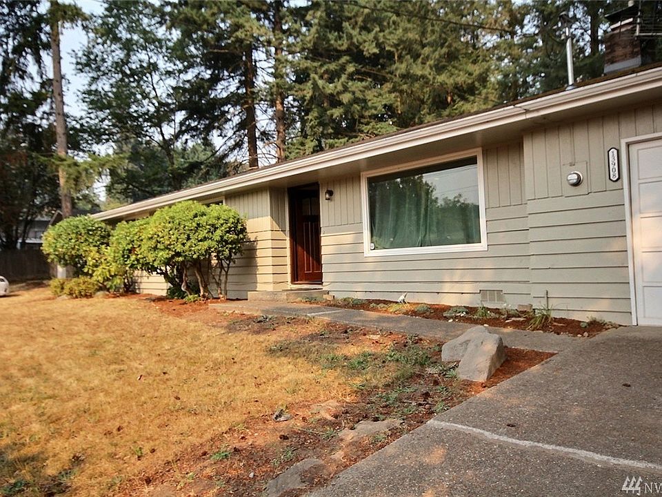 Front of home with 1 car attached garage. Two Car detached garage is to the left out of sight.