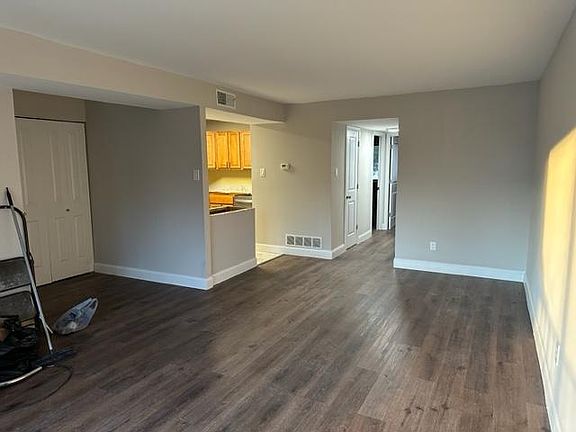 Living Area - view into kitchen and hallway to bathroom and bedrooms