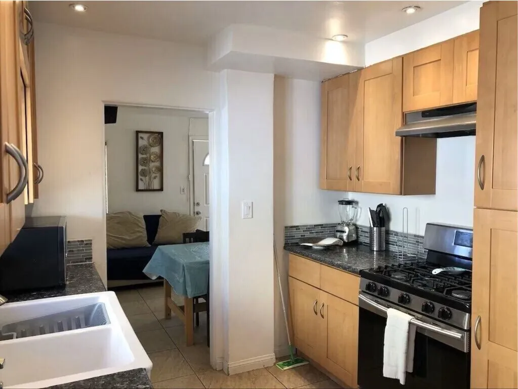 Partial view of kitchen from inside looking out to living room. Beautiful, wood, granite, stainless steel, etc. - 710 Zanzibar Ct